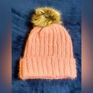 Pink beanie with a puff